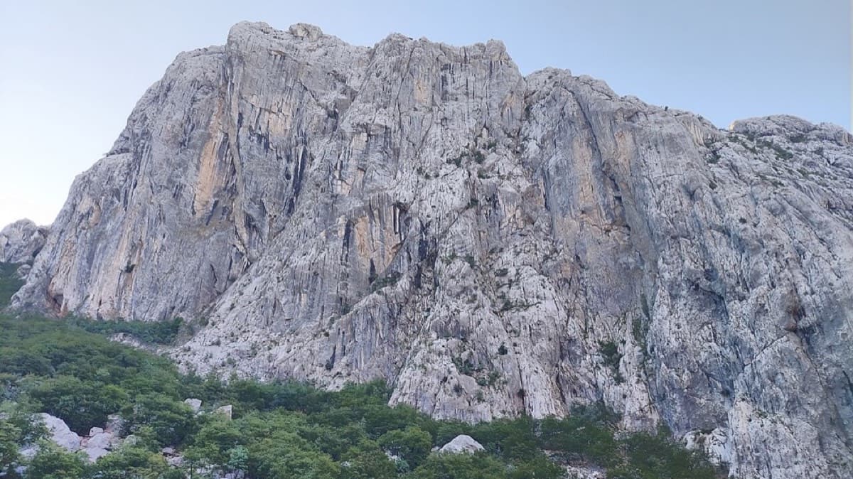Anića kuk seen from the north-west, the side from which the approach path climbs under the faces towards the north face.