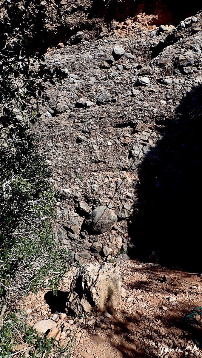 The base of Anorexia: the characteristic block lying on the ground at the foot of the conglomerate wall.