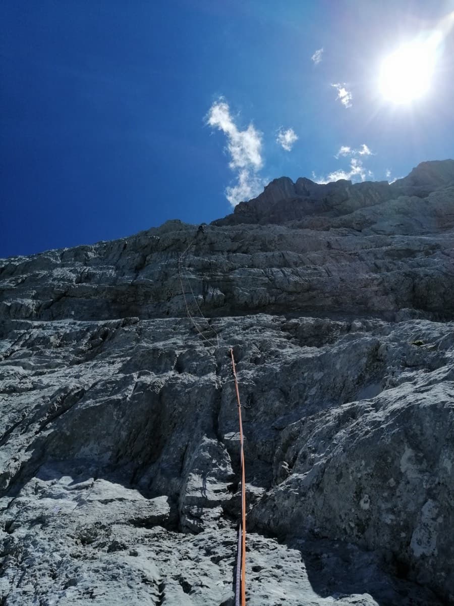 Looking up the first two pitches from the foot of the north-west face: big water-worn flutings (2020 party).