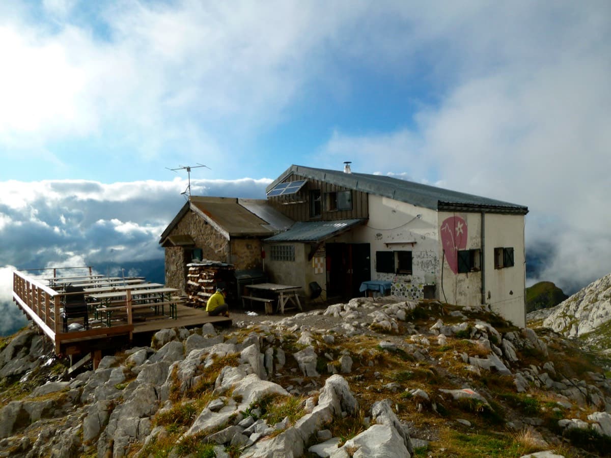 The Refuge de la Pointe Percée (Gramusset, 2,164 m), the landmark the approach passes: the path of the Pointe Percée normal route continues from here.