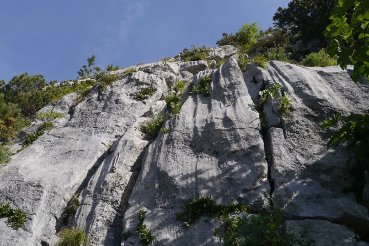 The start of Highway: water-runnelled limestone slabs at the foot of the south face.