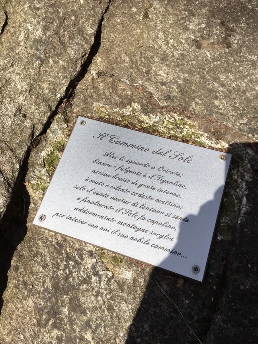 The plaque with the poem that marks the start of the route, fixed to the slab at the foot of pitch 1.
