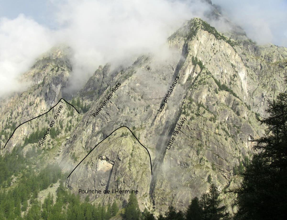The slabs above Ailefroide with the lines named: Palavar-les-Flots follows the long arête left of centre, with Les Prédateurs and Little Palavar to its right and the Pounche de l'Hermine buttress below.