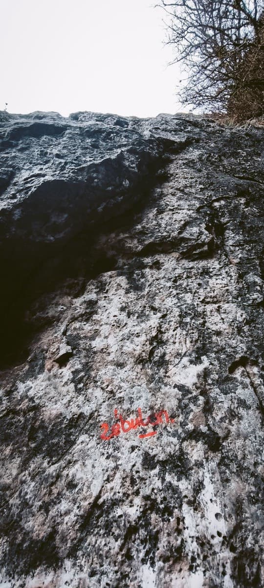 The start of the route: 'Zébulon' is painted in red on the rock at the foot of the first pitch (March 2025).