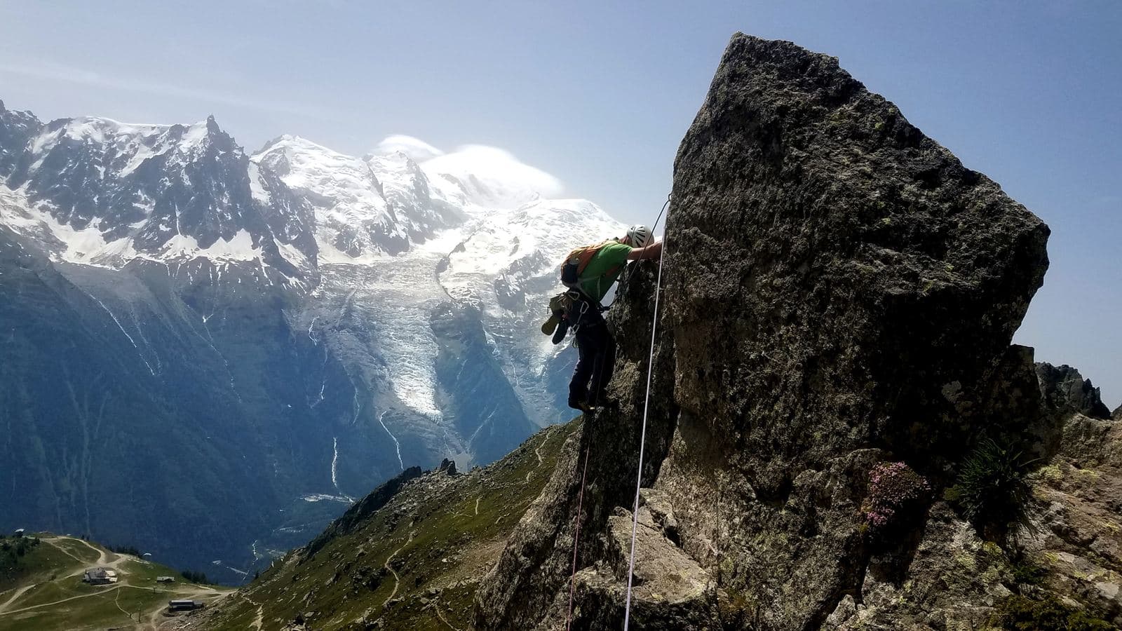 A climber on Cocher-Cochon, with the Mont Blanc massif behind