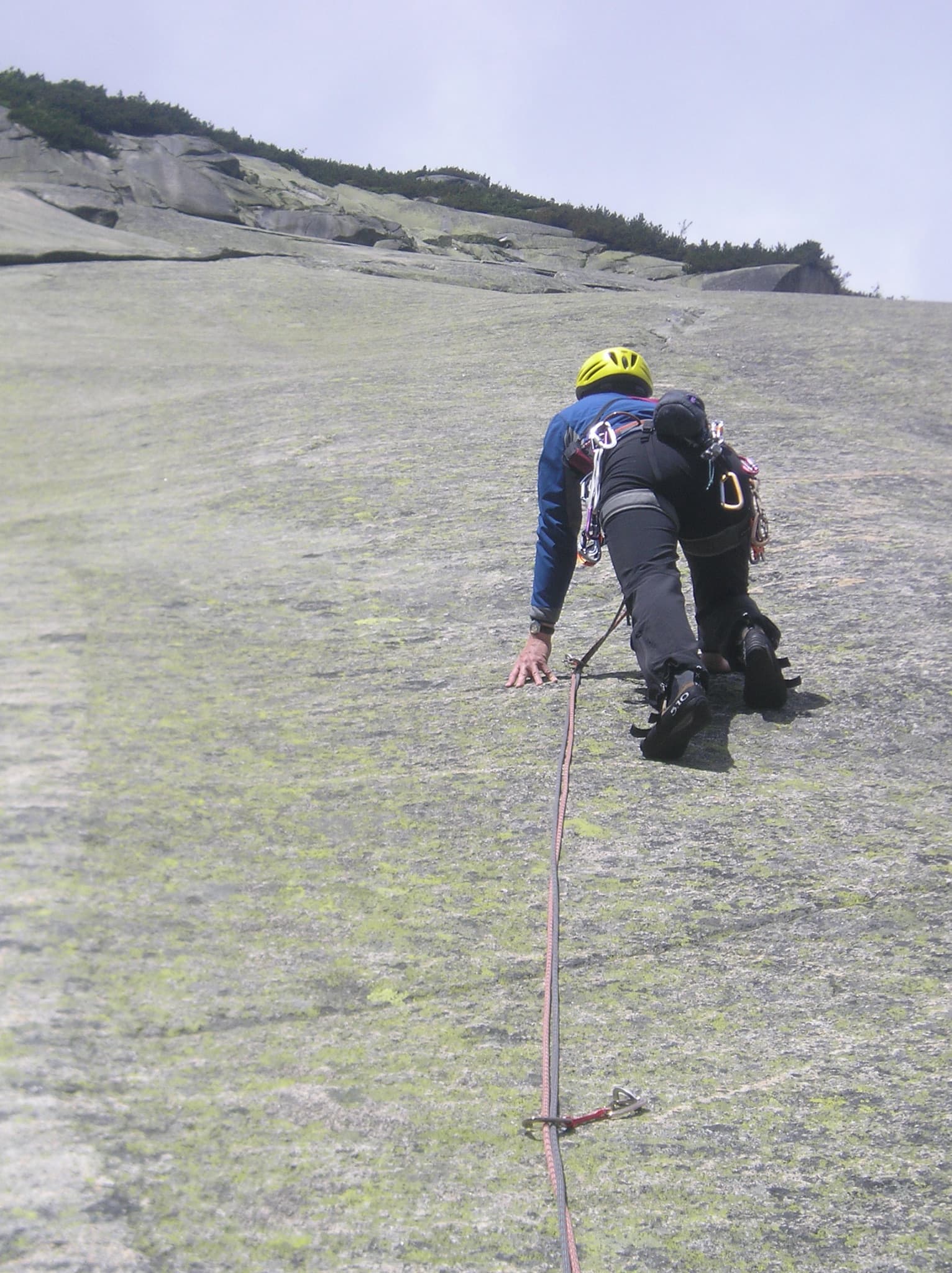 A climber on the 'flying carpet' slab of Fliegender Teppich at Gerstenegg, Grimsel.