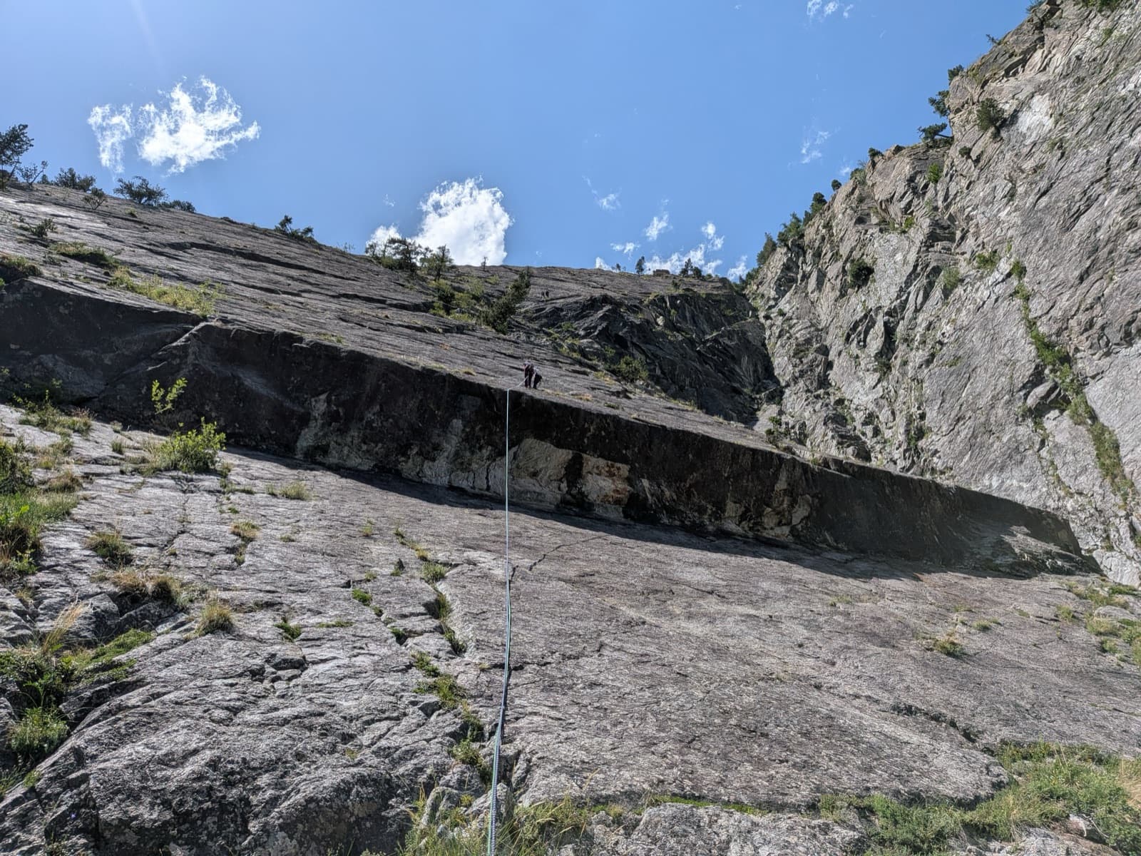 A view of the region, not this route's wall. The Palavar slabs and their big roof seen from the abseil descent of Palavar-les-Flots.