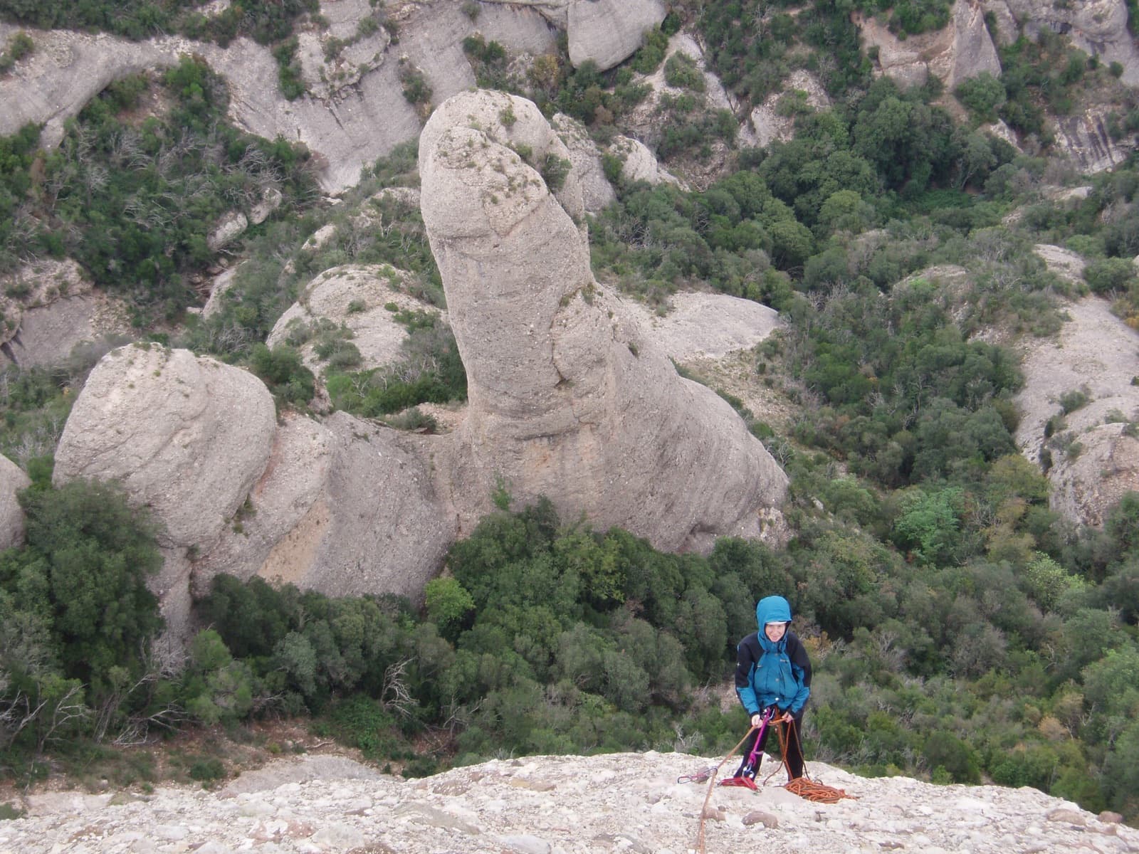 A belay on Via del Carles looking across to the Trencabarrals needle.