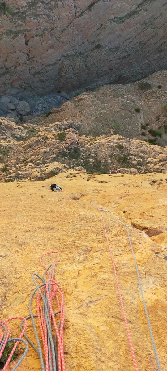 Looking down the first hard pitch of El Geonauta to the ledges at the foot of the Taoujdad's west face