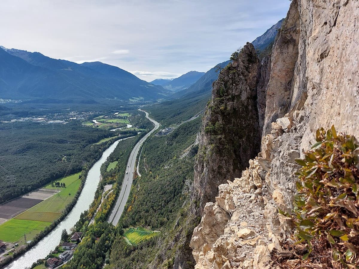 View west along the Inn valley from the top of the Geierwand near Haiming, with part of the wall on the right