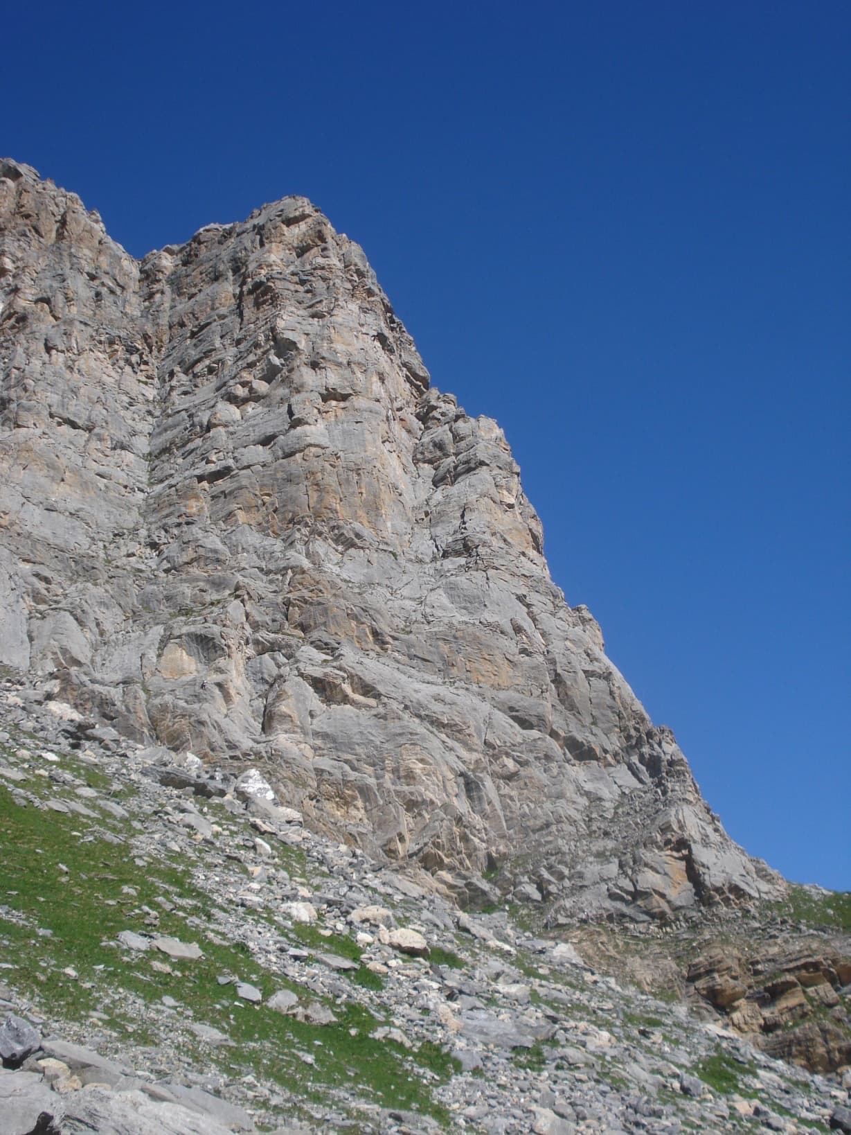 The east pillar of the Grand Marchet, seen face on in the centre; the abseil line comes down the corner on the left