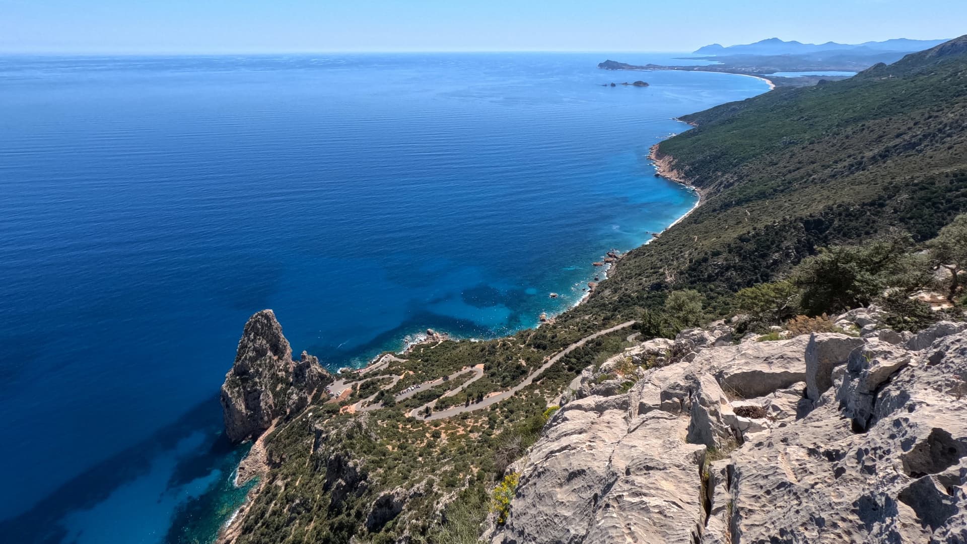 Looking down on the Pedra Longa stack and the coast from high on Atlantide
