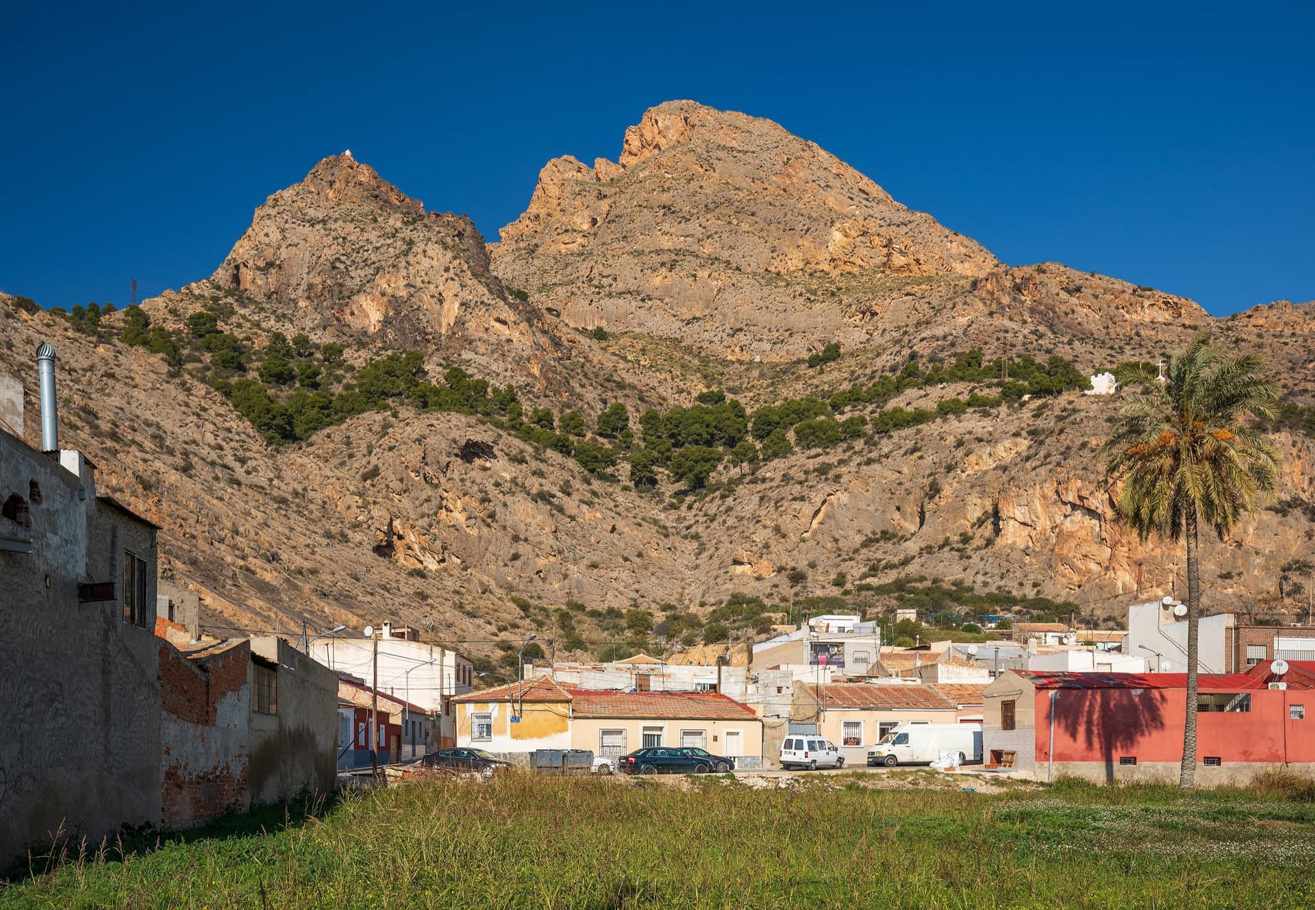 The Sierra de Callosa rising behind the houses of Redován; the La Pancha climbing sector is on this side of the range, a short walk above the village