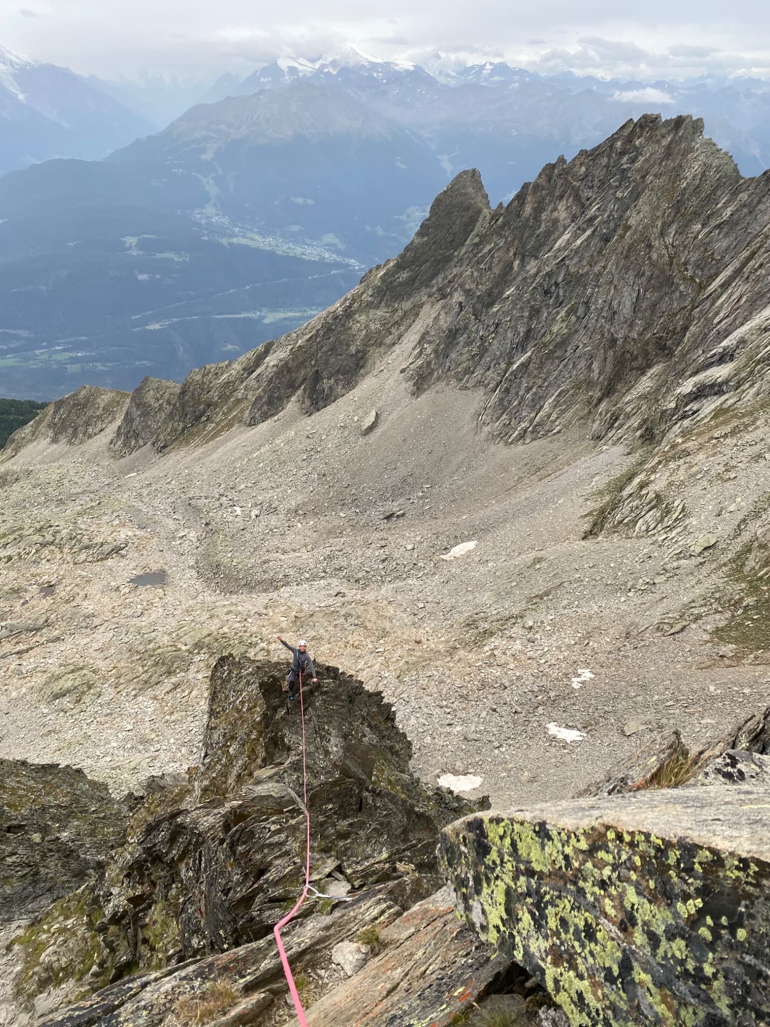 Looking down the upper ridge pitches of Gemstritt on the Wiwannihorn, with the Rhône valley beyond