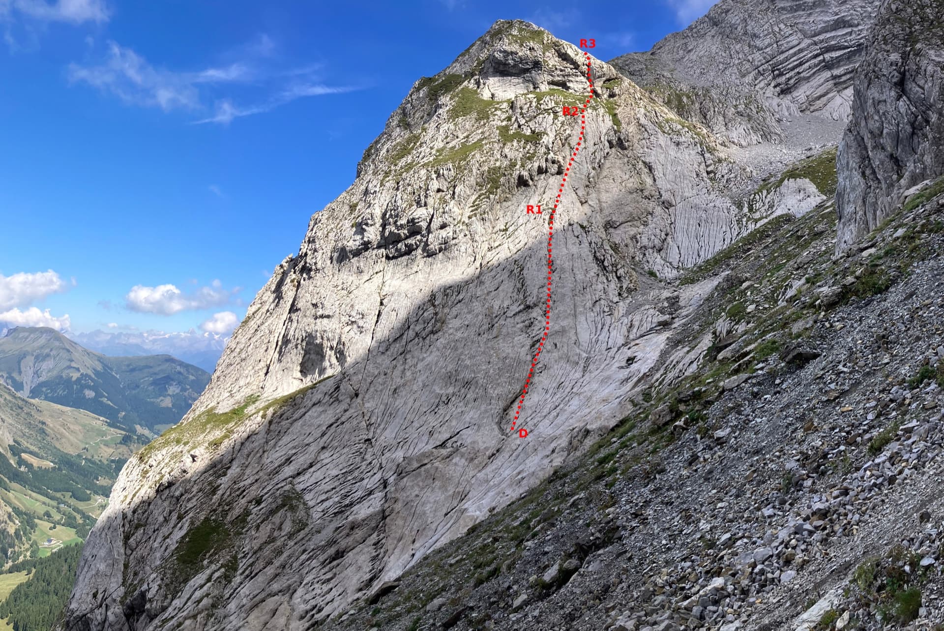 The first three pitches of the Arête à Marion drawn on the slab at the foot of the ridge, with the belays marked