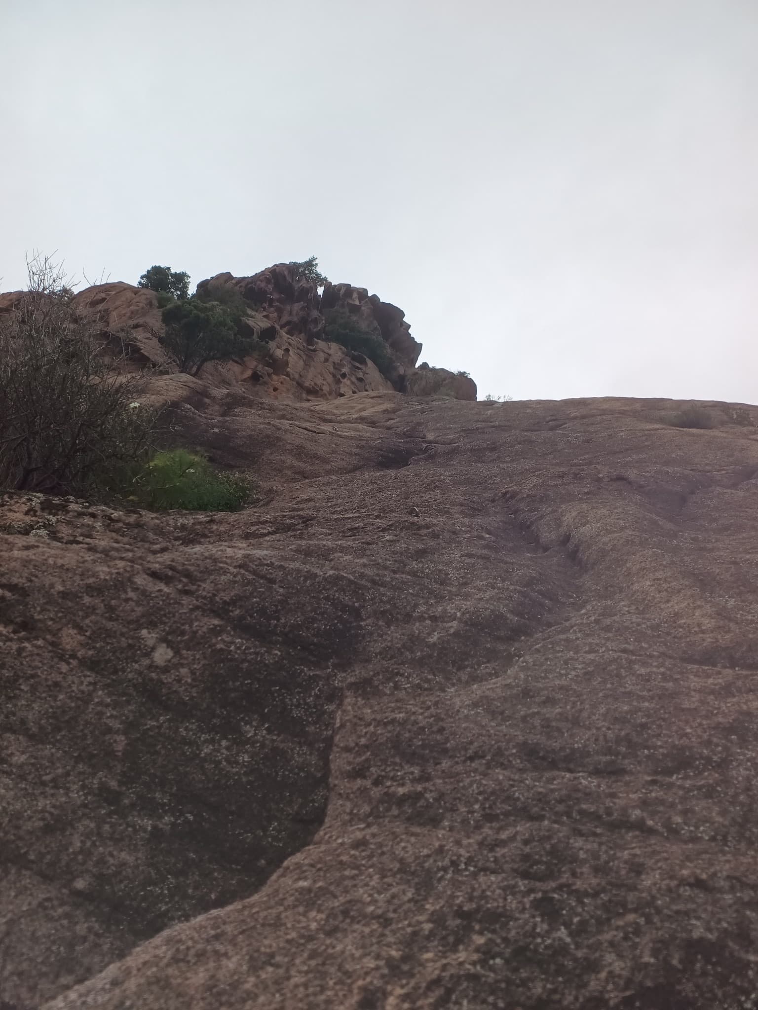 Looking up the slabs of the Punta d'Arghjavara, photographed on an ascent of Patience dans l'azur in April 2026