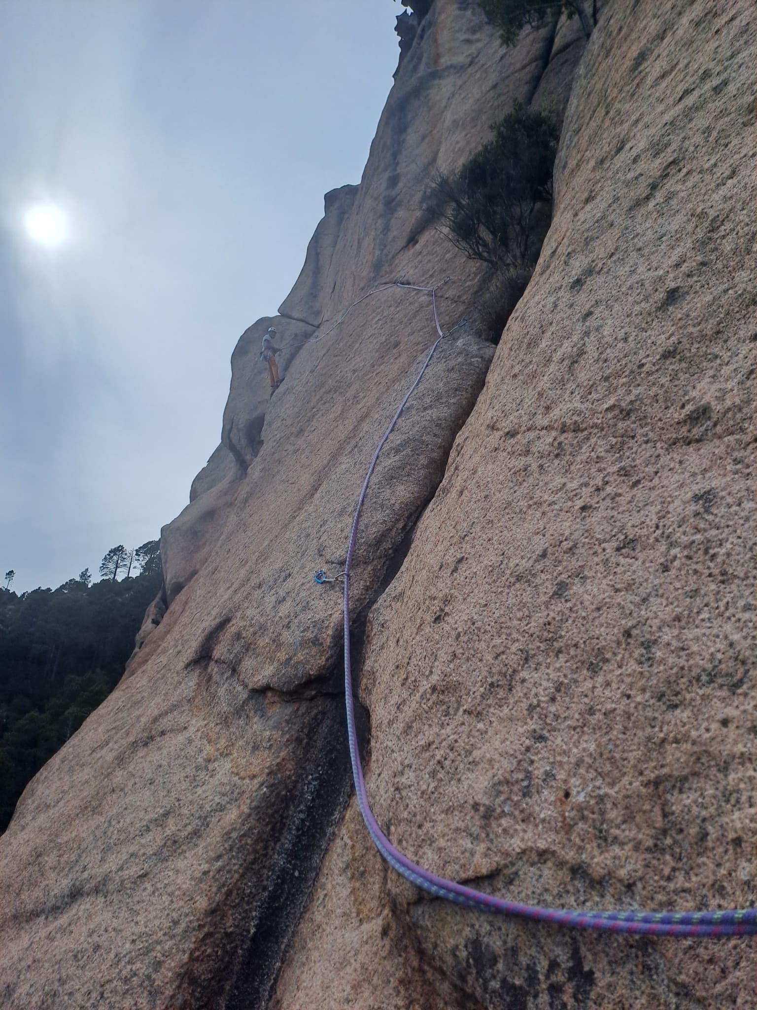 A climber on the thin 7a traverse of La célébration du lézard, September 2026