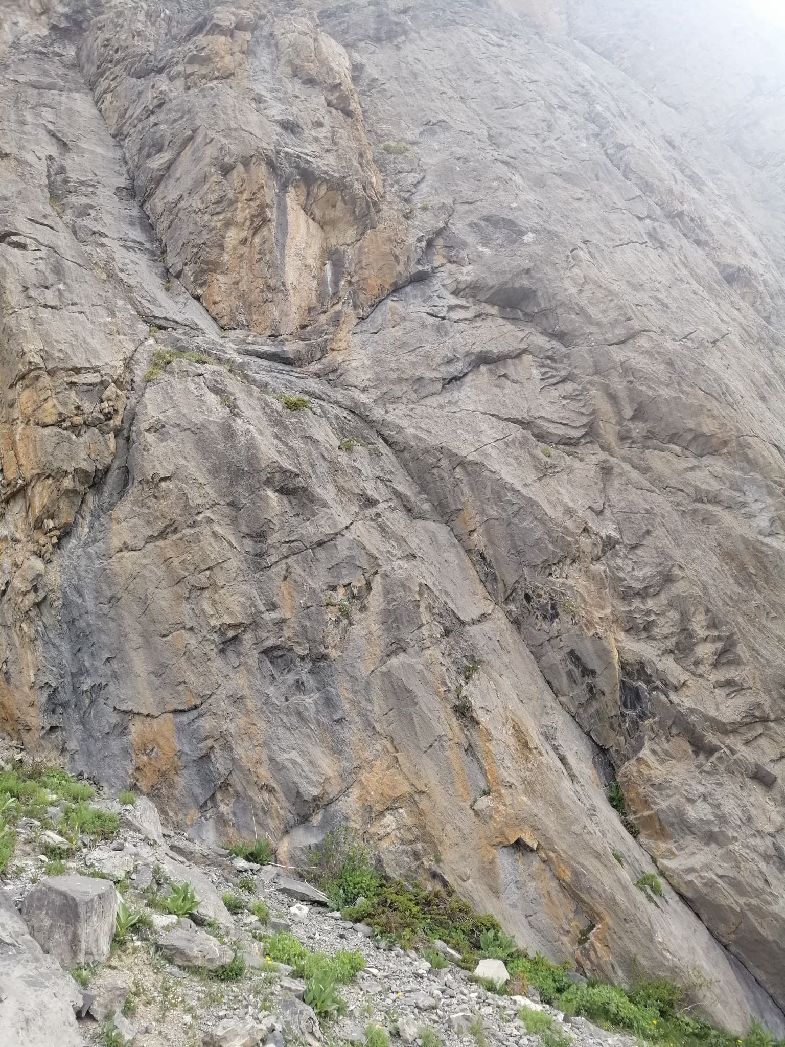 The lower wall of the first Queyrellin tower: the route follows the slabby ramp slanting up to the left