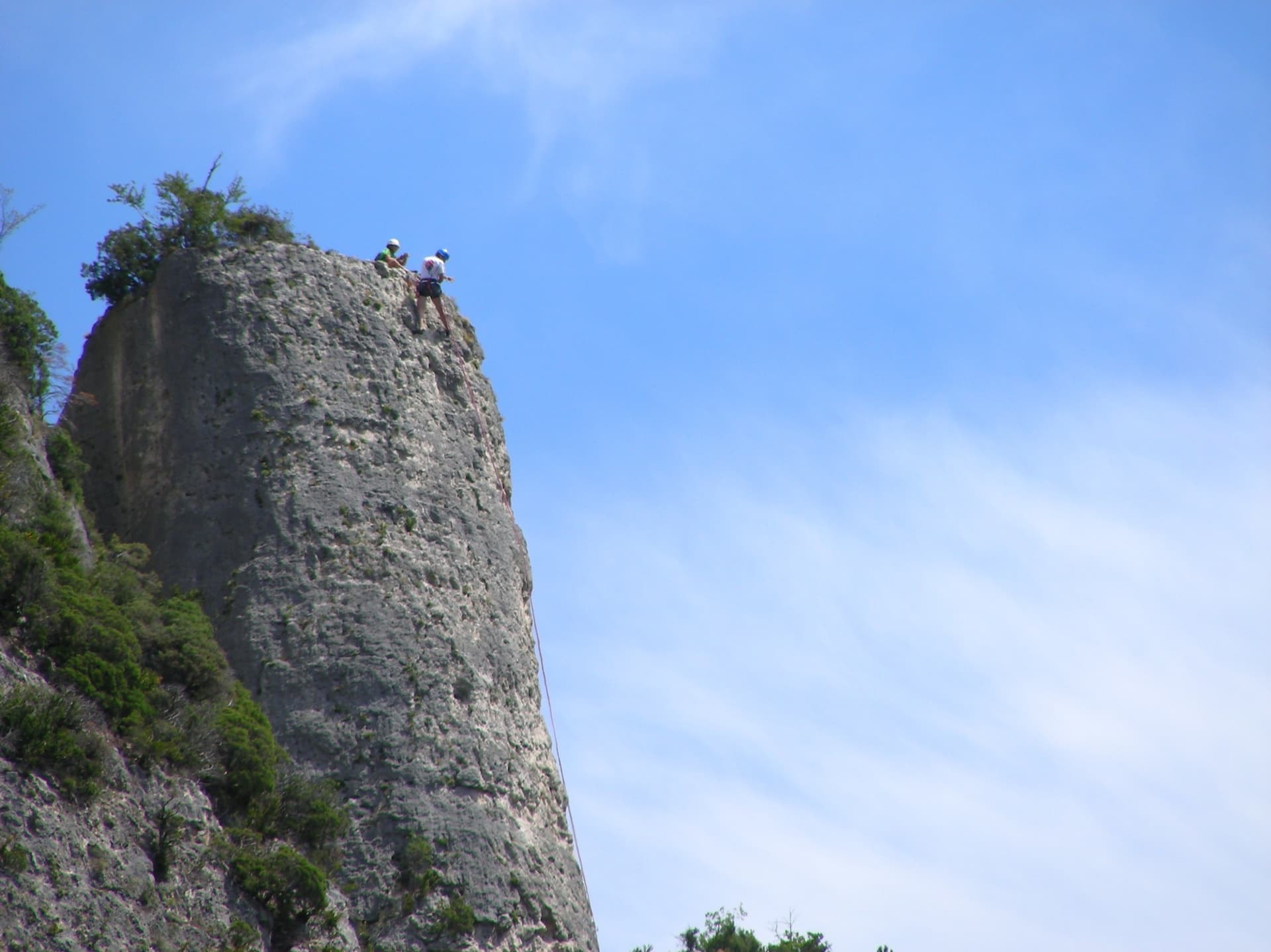 Climbers on the flat summit of the Bitard pillar, Gorges de la Jonte