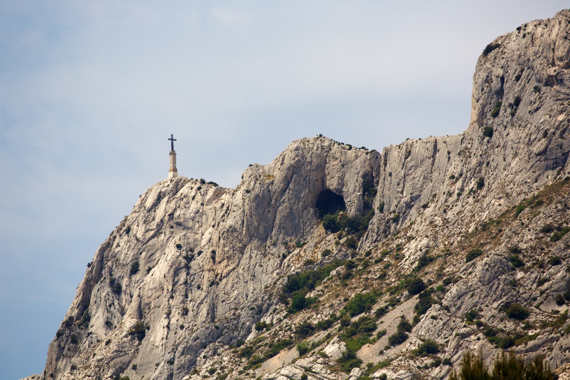 The Croix de Provence and the upper cliffs of Sainte-Victoire; La Commande finishes at the priory near the cross