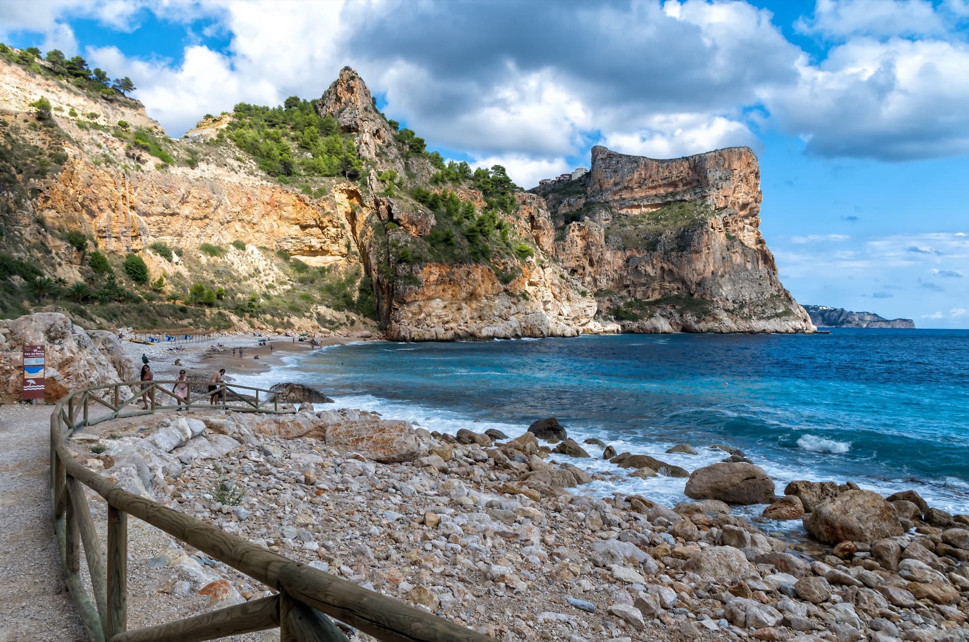 The flat-topped sea cliff of Morro Falquí closing the south end of Cala del Moraig, Benitatxell. Sonjannika climbs on this headland; the line cannot be pointed to from here.