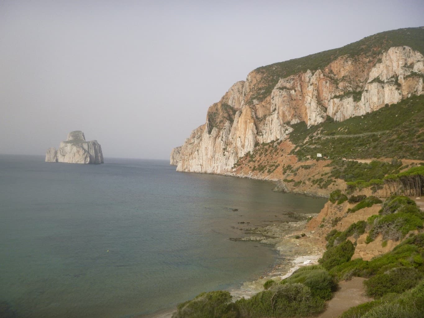 The Masua sea cliffs with the Pan di Zucchero stack offshore