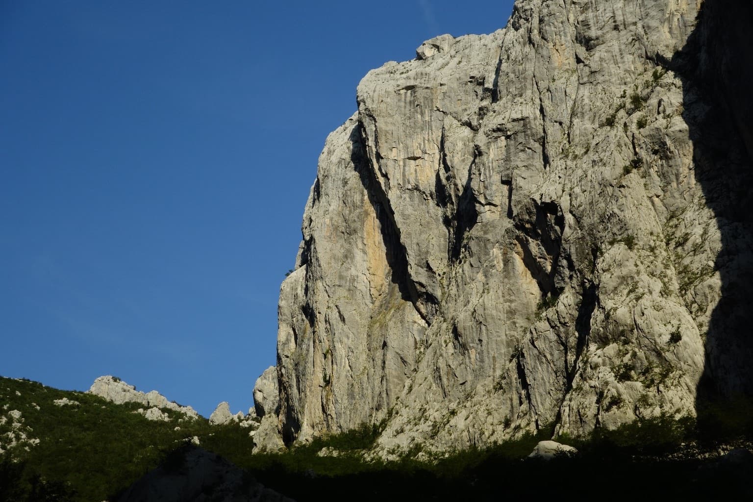 The north-west face of Anića kuk in evening light; the route is not marked.