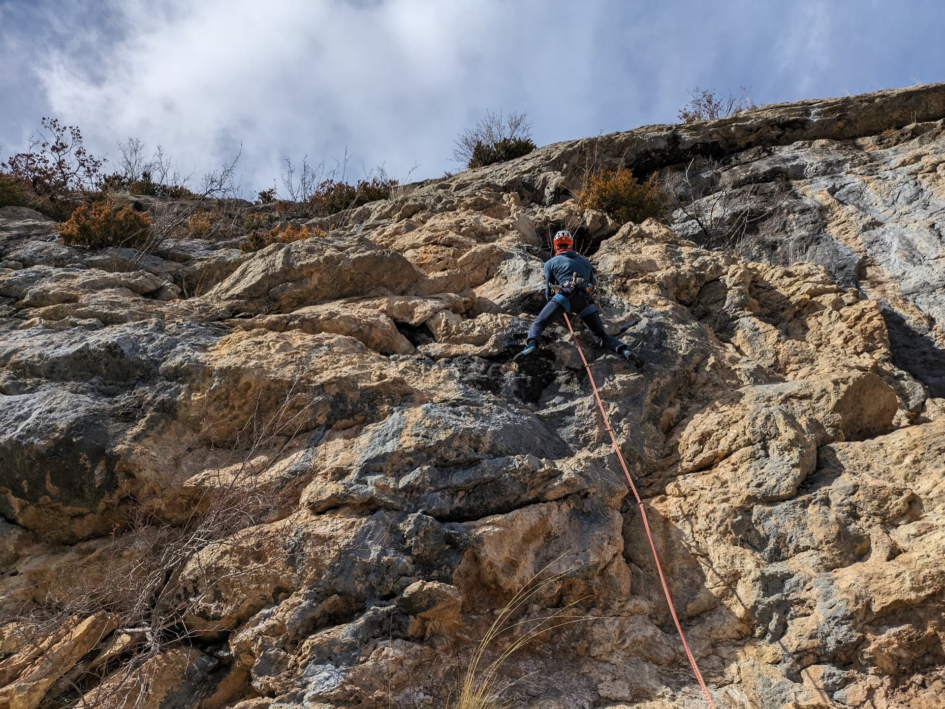 Leading the steep, physical wall of pitch 4 (6b) of Fleur de Lotus on the Quiquillon, Orpierre