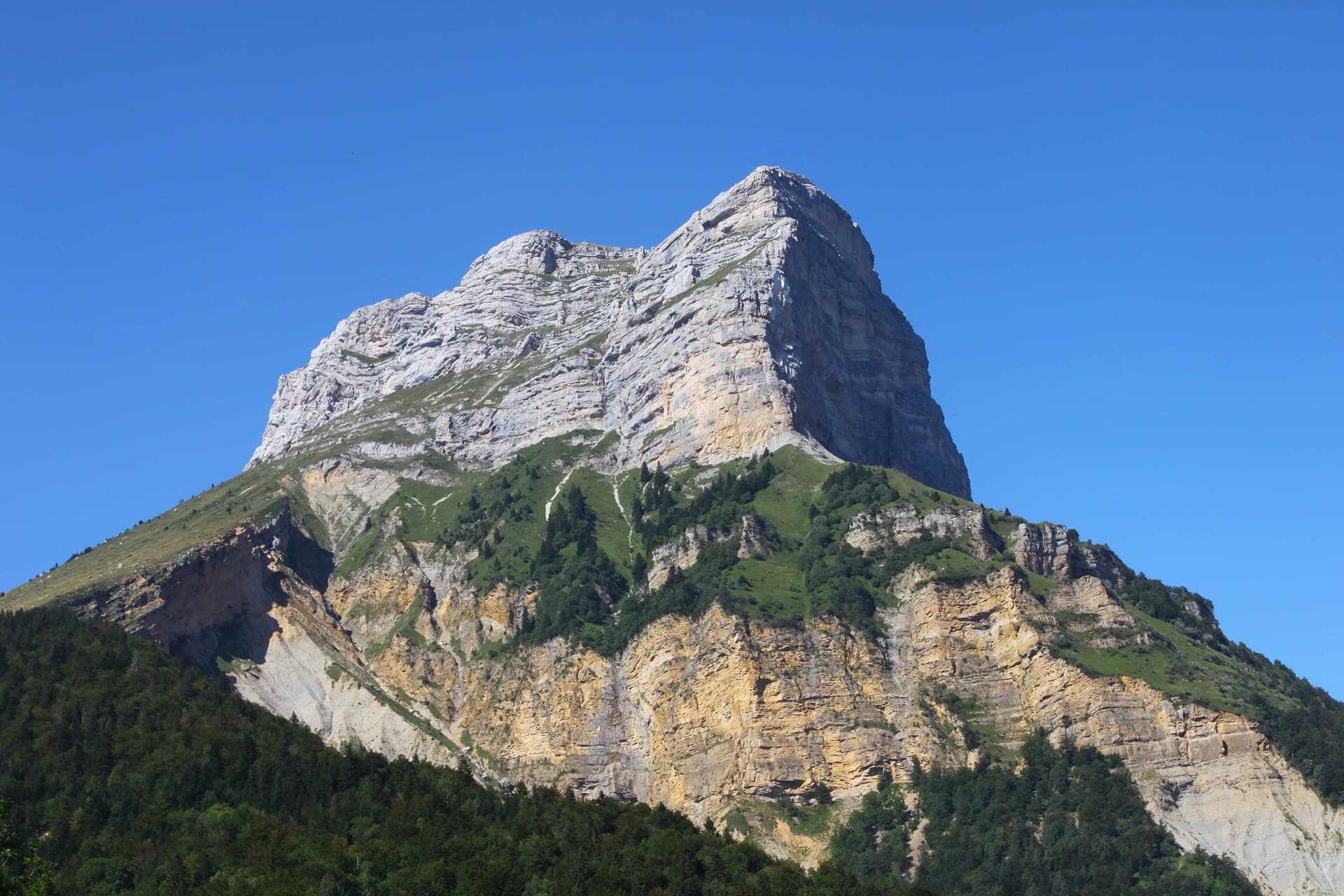 The Dent de Crolles from the Col du Coq, its banded south-west face lit by the afternoon sun.